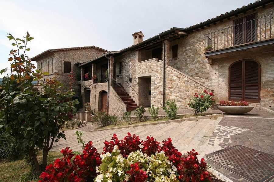 A medieval vicolo (narrow alley) in Bevagna with stone paving and 13th century buildings