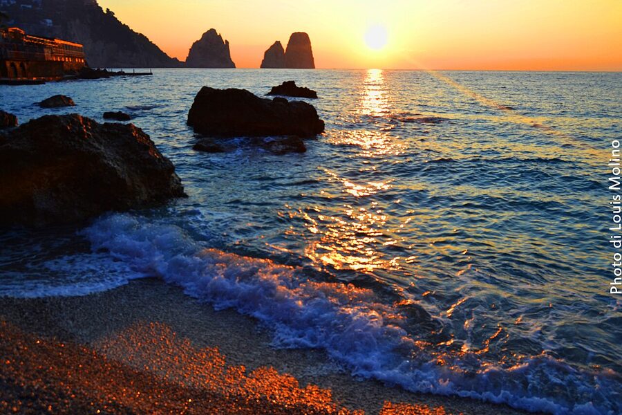 The Faraglioni sea stacks off the southeastern coast of Capri at dawn