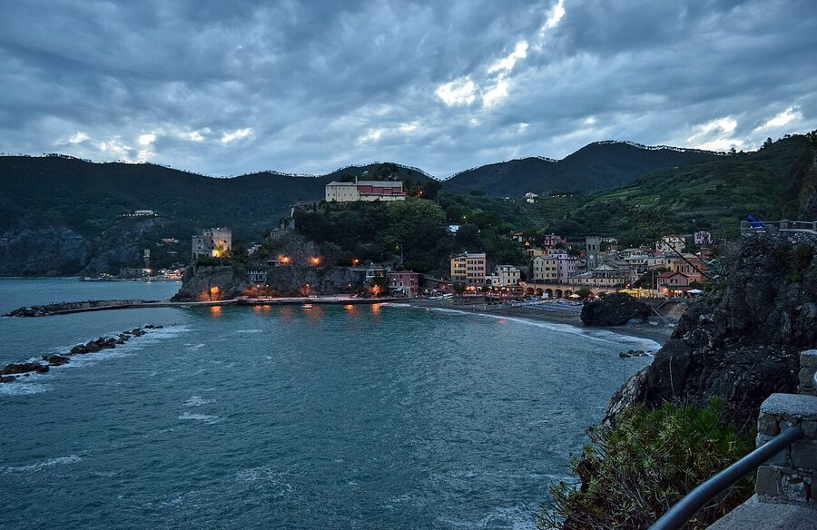 The port of Monterosso al Mare in the Cinque Terre with the beach, fishing boats and pastel buildings