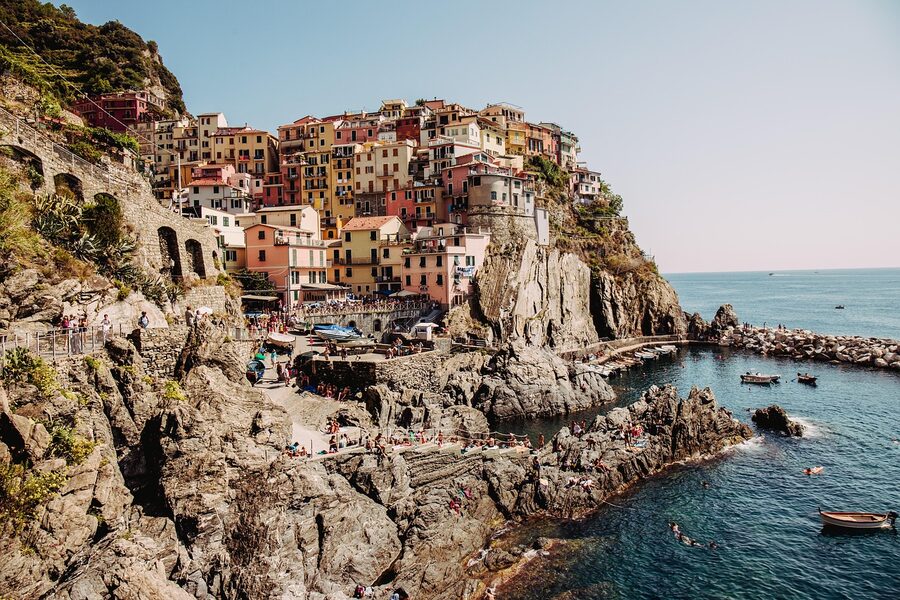 The colourful village of Manarola in the Cinque Terre with terraced vineyards and the Ligurian Sea