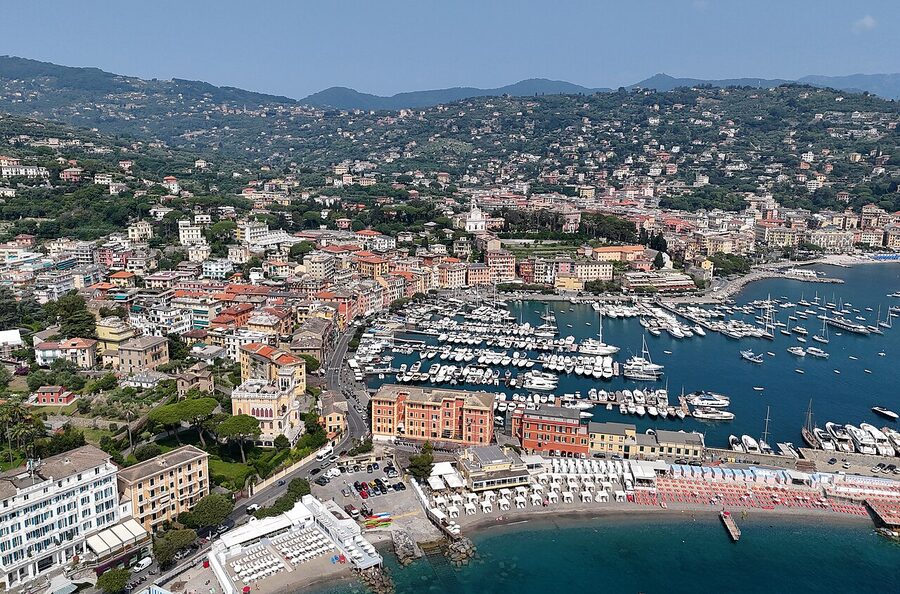 Santa Margherita Ligure with its pastel hotels, marina with yachts, and palm trees along the seafront