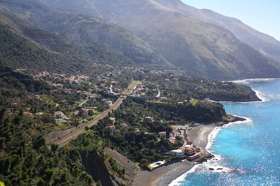 The coast at Acquafredda di Maratea with small houses on the steep cliffs above the Tyrrhenian Sea