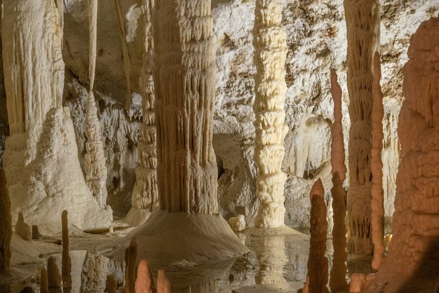 Stalactites and stalagmites inside the Frasassi Caves near Genga in Marche, a vast underground chamber