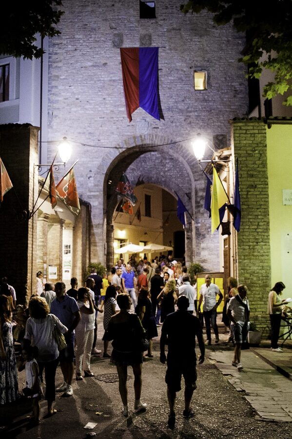 Porta Vecchia illuminated at night during the Palio dei Quartieri festival in Nocera Umbra