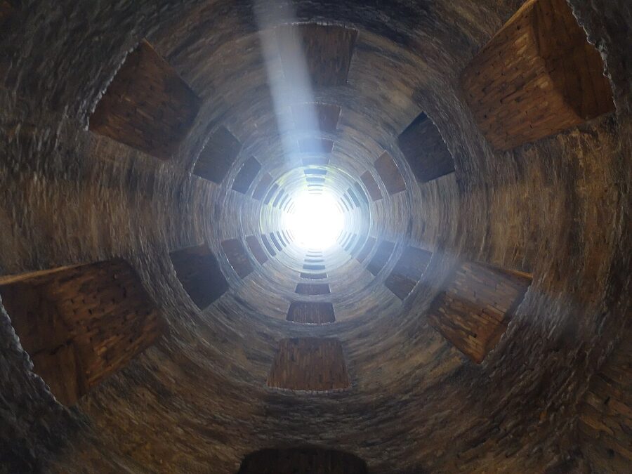 View inside the Pozzo di San Patrizio, a Renaissance double-helix well, looking up at concentric stairways