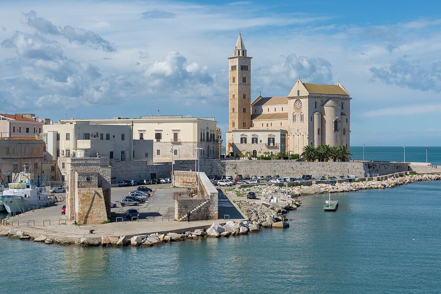 The Romanesque Trani cathedral of San Nicola Pellegrino by the sea, with pink-white stone and bell tower