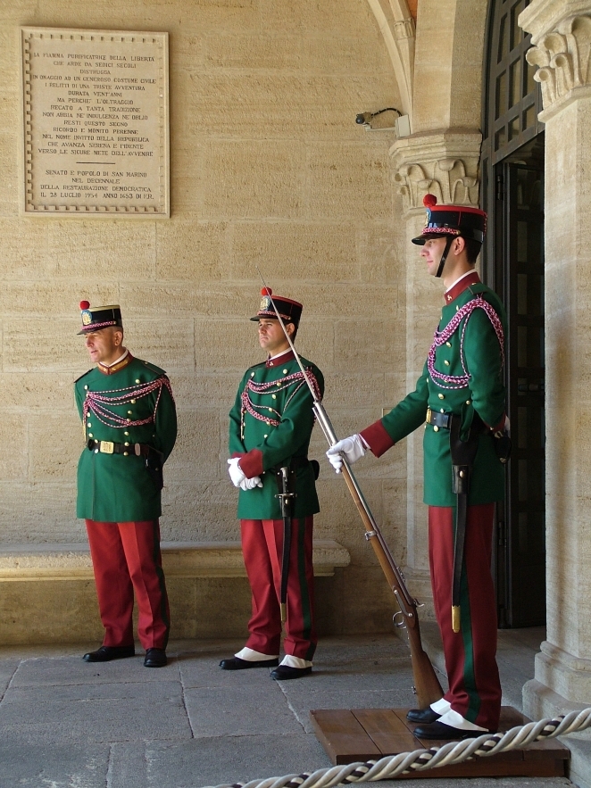 A member of the Guardia di Rocca in ceremonial uniform standing at the Palazzo Pubblico in San Marino