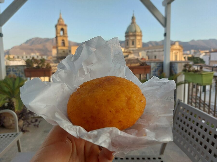 An arancina filled with pasta alla Norma ingredients, Palermo style