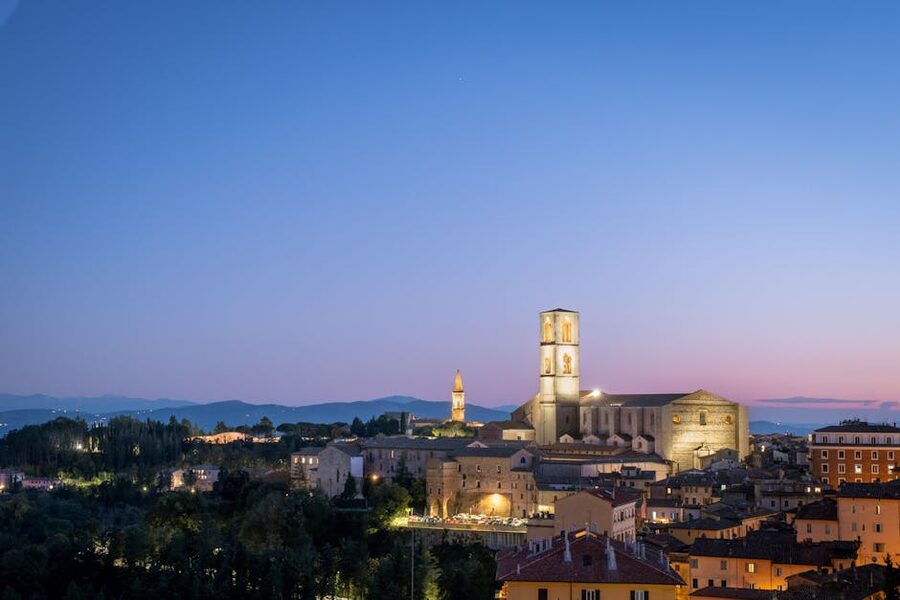 Perugia at twilight showing the medieval skyline, San Domenico church and the university hilltop position