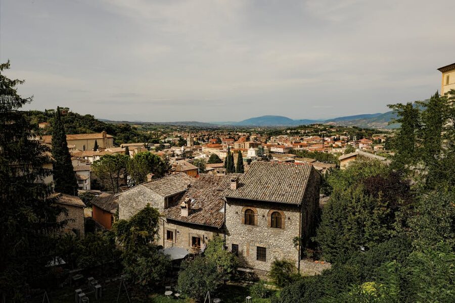 Spoleto medieval town with historic architecture and lush green hills surrounding
