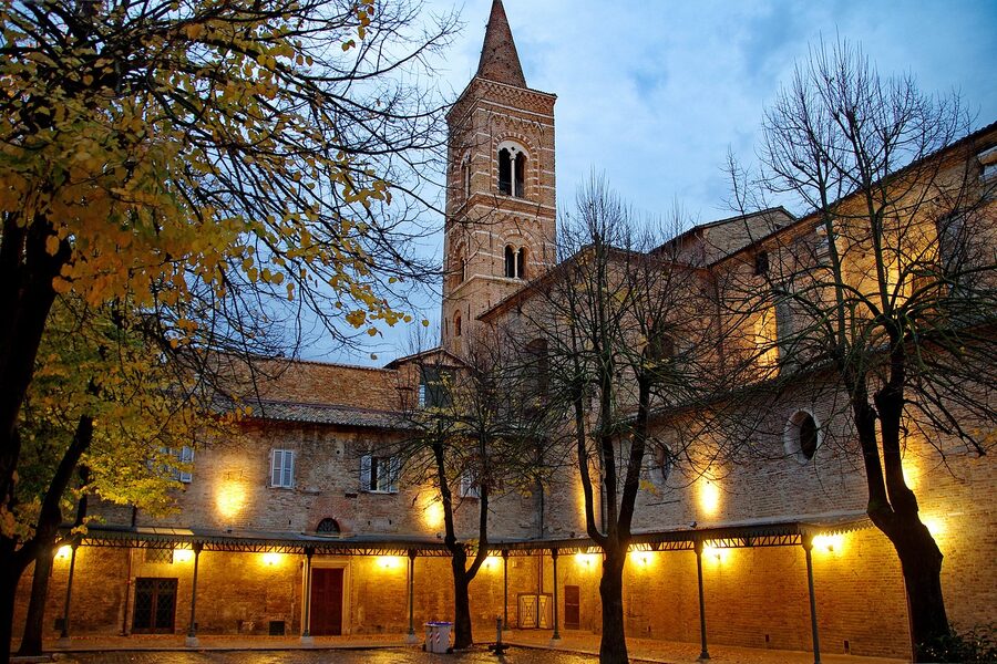 The Gothic bell tower of the Chiesa di San Francesco in Urbino with mullioned windows