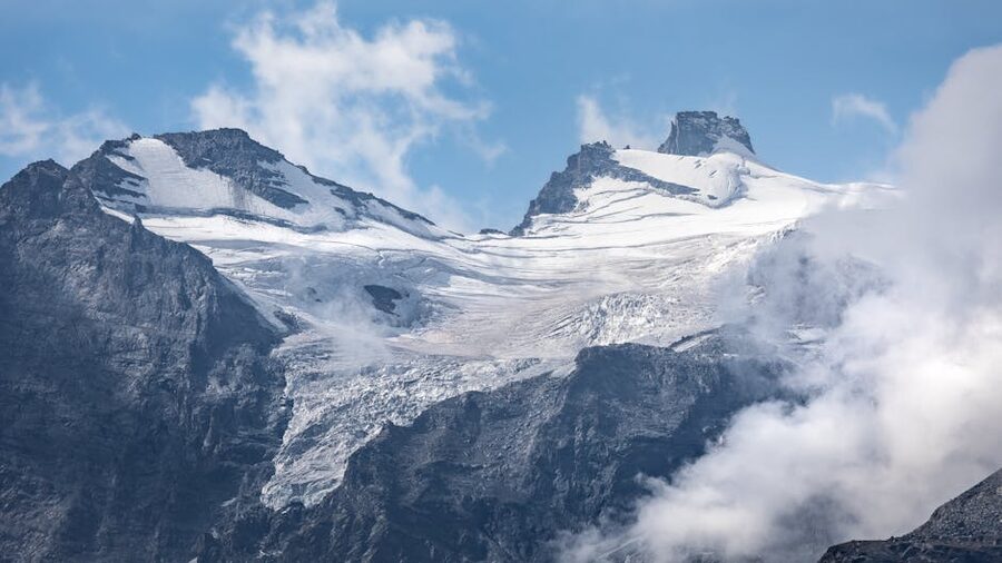 Gran Paradiso, a 4061-metre snow-capped peak in Valle d'Aosta under a clear blue sky